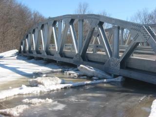snow and ice under West Deering Bridge